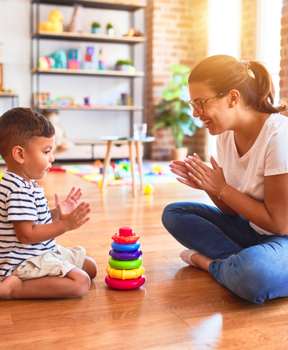 A parent and child playing together